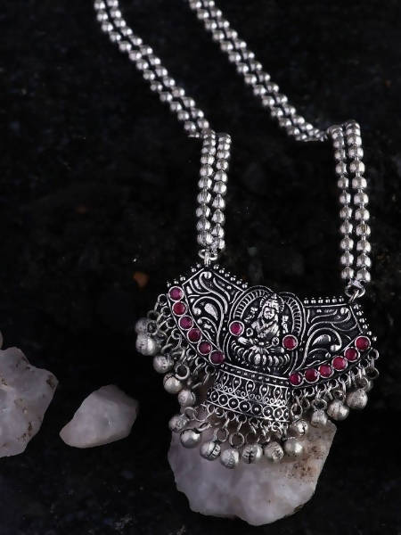 Laxmi Mata oxidized silver long statement necklace with red stone accents on a mannequin