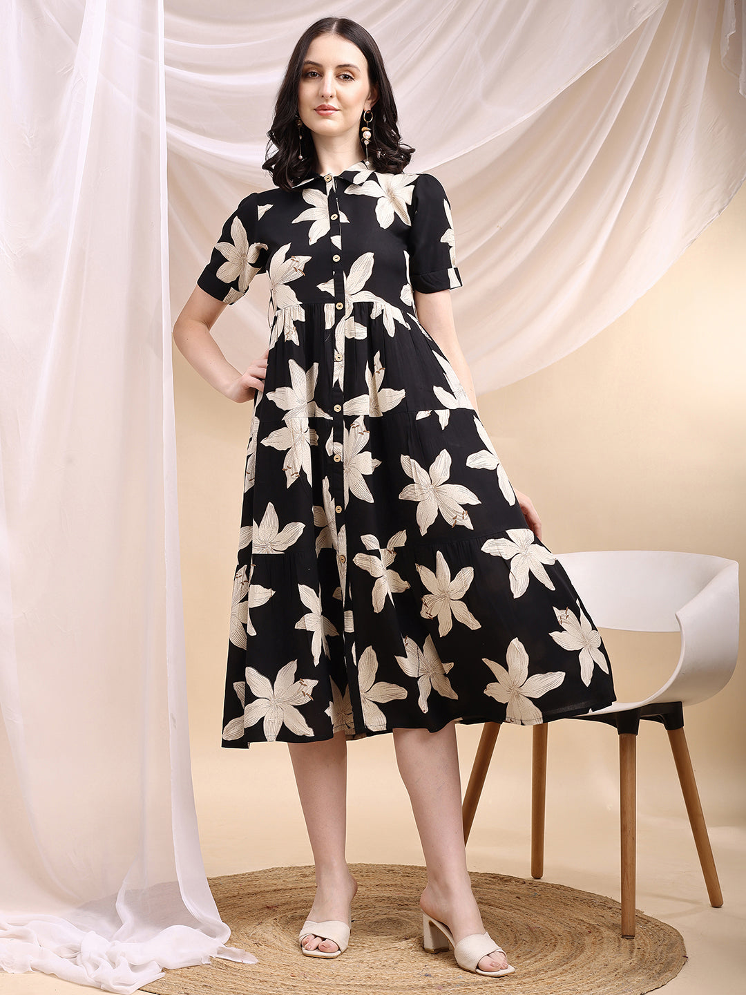 Black midi shirt dress featuring an oversized beige floral print and 3/4th sleeves