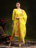Woman wearing a vibrant yellow Chanderi kurta set with intricate embroidery, matching pants, and a dupatta.