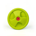 Green dog frisbee with a red center on a white background