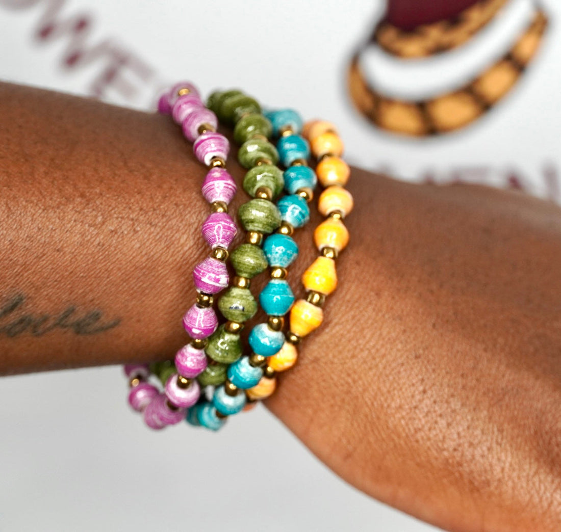 Set of 4 bohemian paper bead bracelets featuring purple, olive-green, turquoise, orange, and gold accents.
