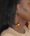 2.5 inch bohemian hoop earrings with colorful rainbow paper beads and gold spacers