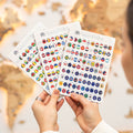 Close up of colorful wooden flag sticky pins designed for world map travel boards