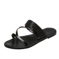 A pair of sleek black women's sandals featuring a wide rhinestone-embellished strap and a simple flat sole.