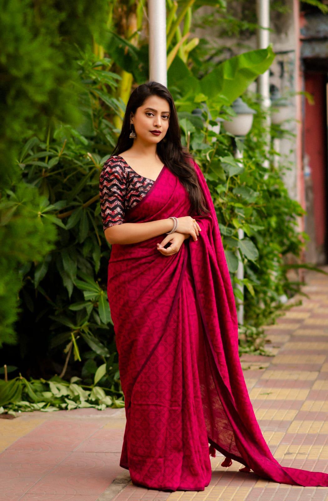Red jute silk saree with self-woven jacquard and batik print blouse