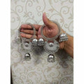 Silver geometric bangles with large jhumka latkan accents for traditional Indian outfits