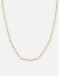 Dainty gold link necklace featuring small delicate heart charms on a polished gold cable chain.