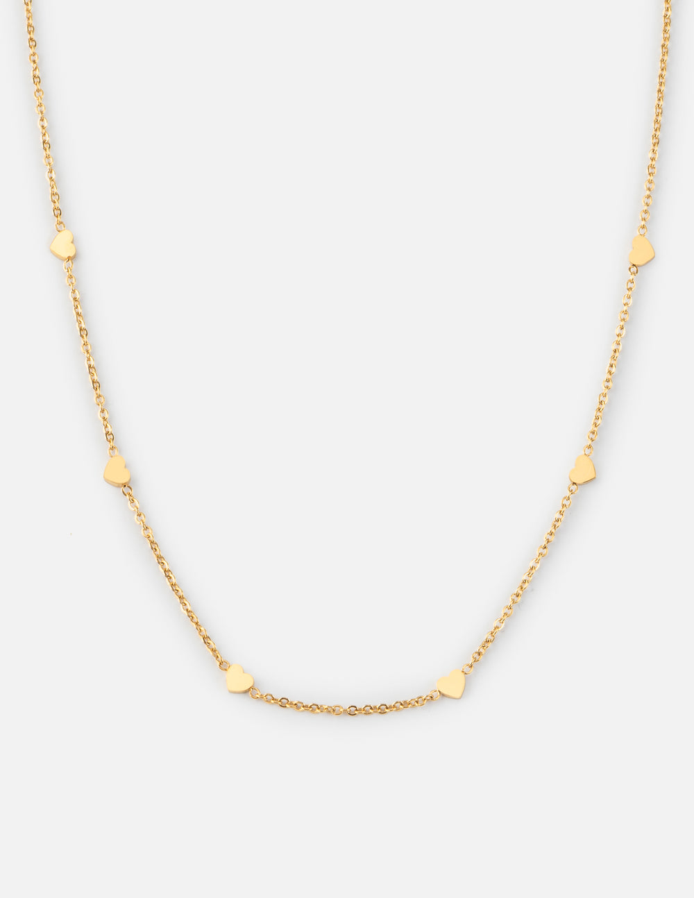 Dainty gold link necklace featuring small delicate heart charms on a polished gold cable chain.