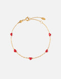 Minimalist dainty love link chain bracelet worn on a woman's wrist
