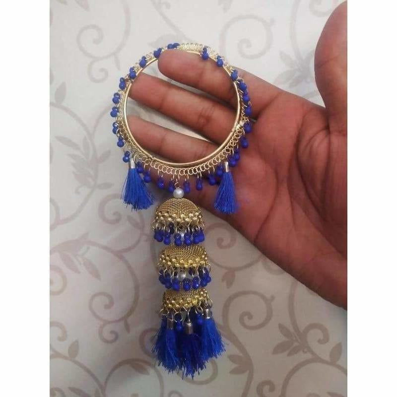 Blue silk thread bangles with hanging gold jhumkas and blue pearl accents
