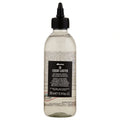 Davines OI Liquid Luster treatment bottle with transparent professional aesthetic.