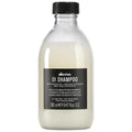Davines OI Shampoo bottle with transparent design, off-white contents, and black label.