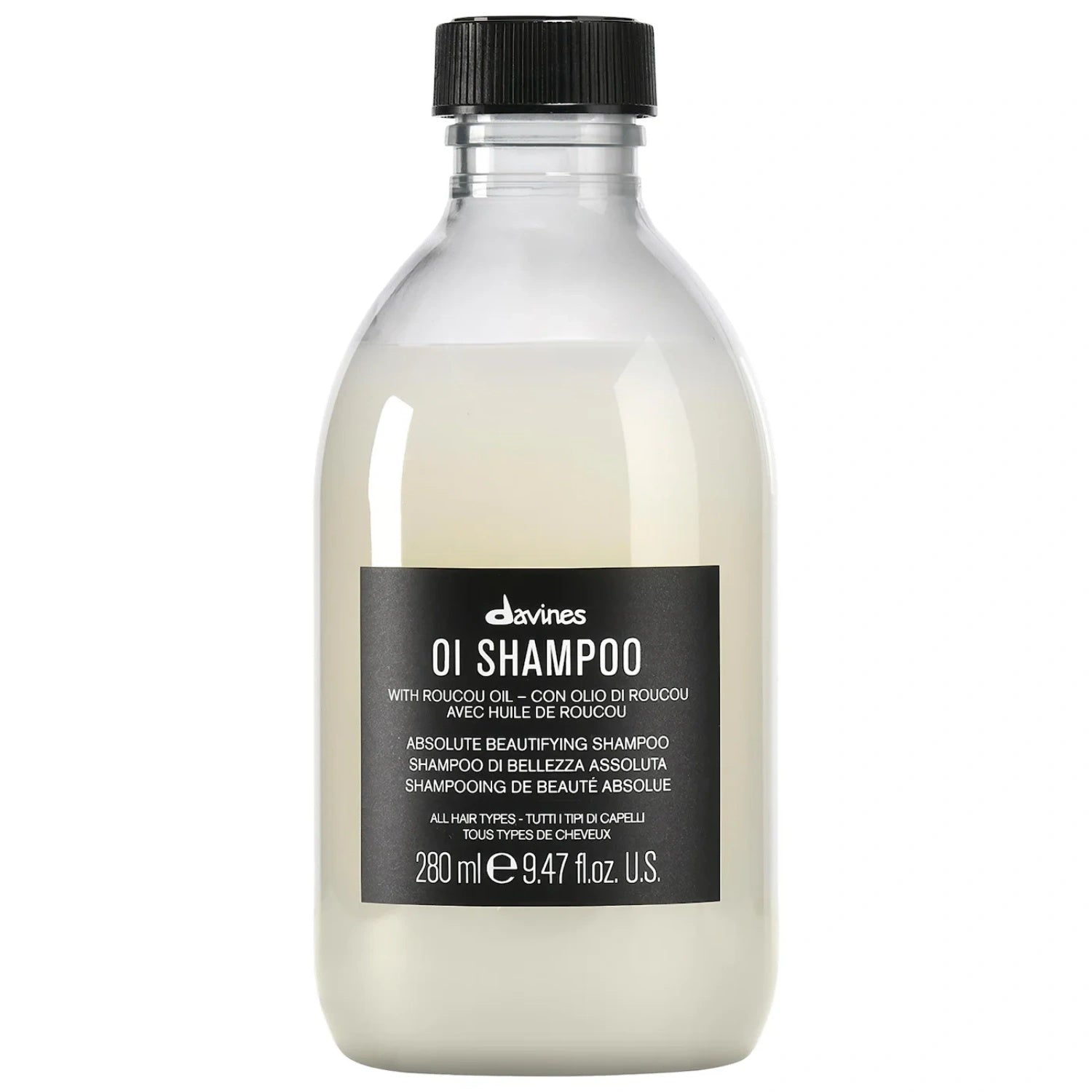 Davines OI Shampoo bottle with transparent design, off-white contents, and black label.