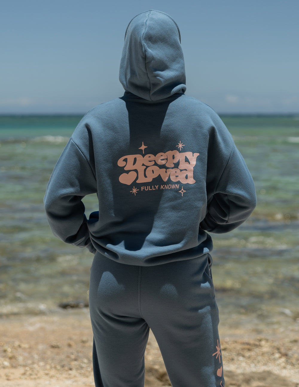 Unisex Deeply Loved cotton hoodie available in dusty blue and pale pink