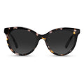 The Demi cat-eye sunglasses featuring a Havana Pearl frame on a neutral background