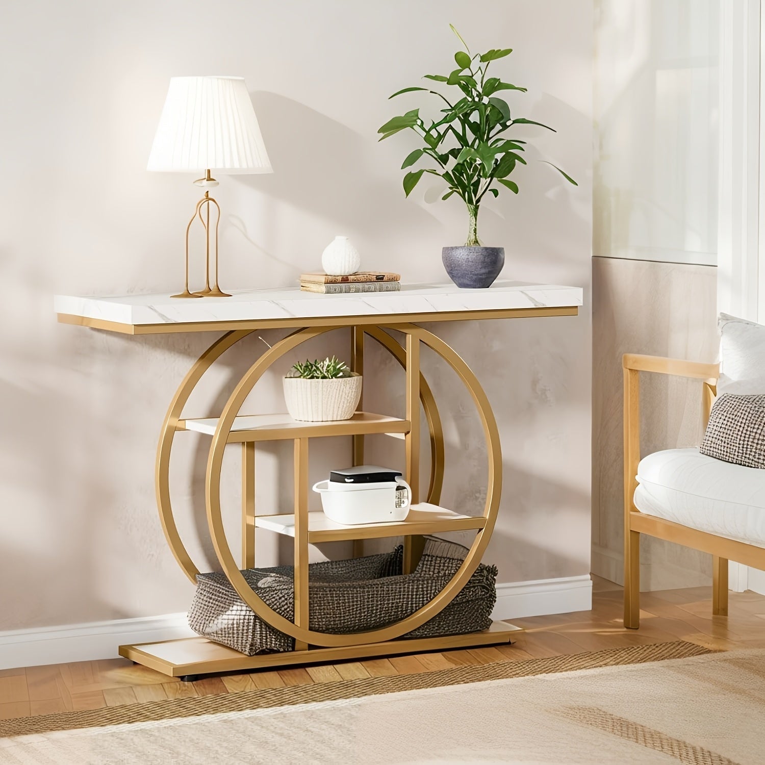 Luxury gold metal console table with a sleek marble-style top in a modern entryway