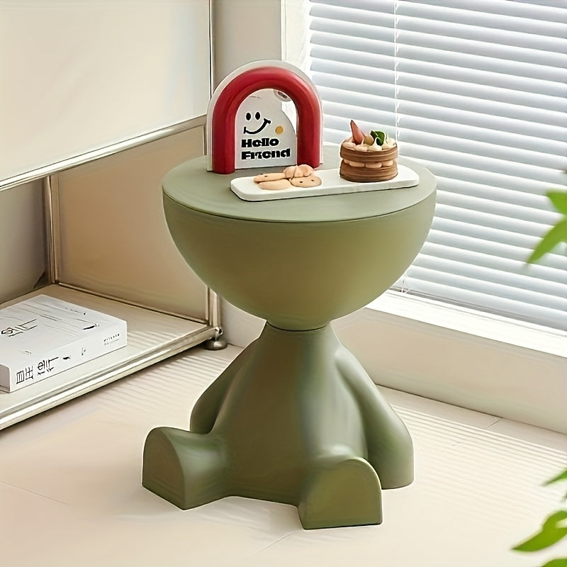 Whimsical bear-shaped modern side table in green, black, and cream colors