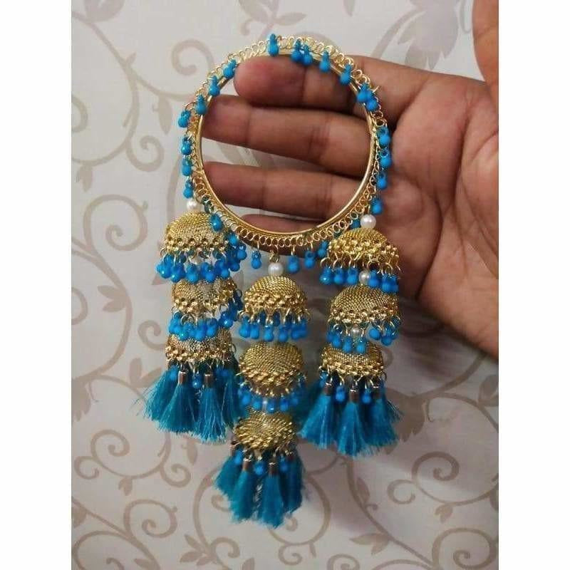 Dista blue silk thread and pearl bangle with gold-tone hanging jhumka charms.