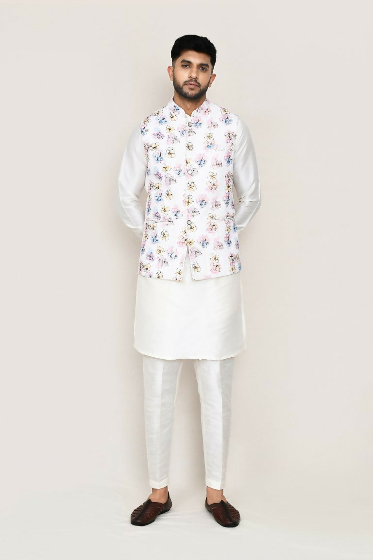 Man wearing a crisp white Art Silk kurta with a matching jacket and straight-fit trousers