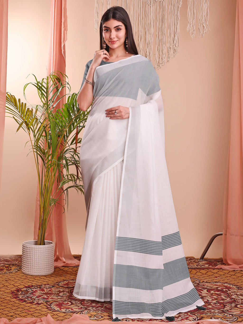 Elegant white linen cotton saree with matching blouse piece