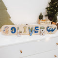 Personalized wooden dinosaur name puzzle for toddlers featuring colorful dino pieces