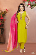 Woman wearing a vibrant yellow soft silk embroidered kurta set with matching dupatta
