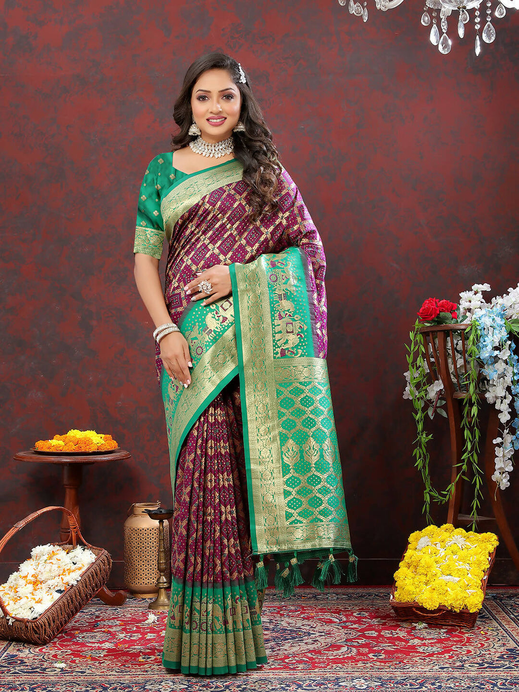 Elegant Wine and Green Patola silk saree with detailed Meenakari woven patterns.