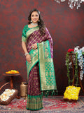 Elegant Wine and Green Patola silk saree with detailed Meenakari woven patterns.