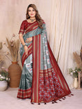 Sophisticated grey soft silk saree featuring elegant weaving.