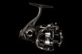 D-MAG spinning fishing reel in black finish shown from side and front view