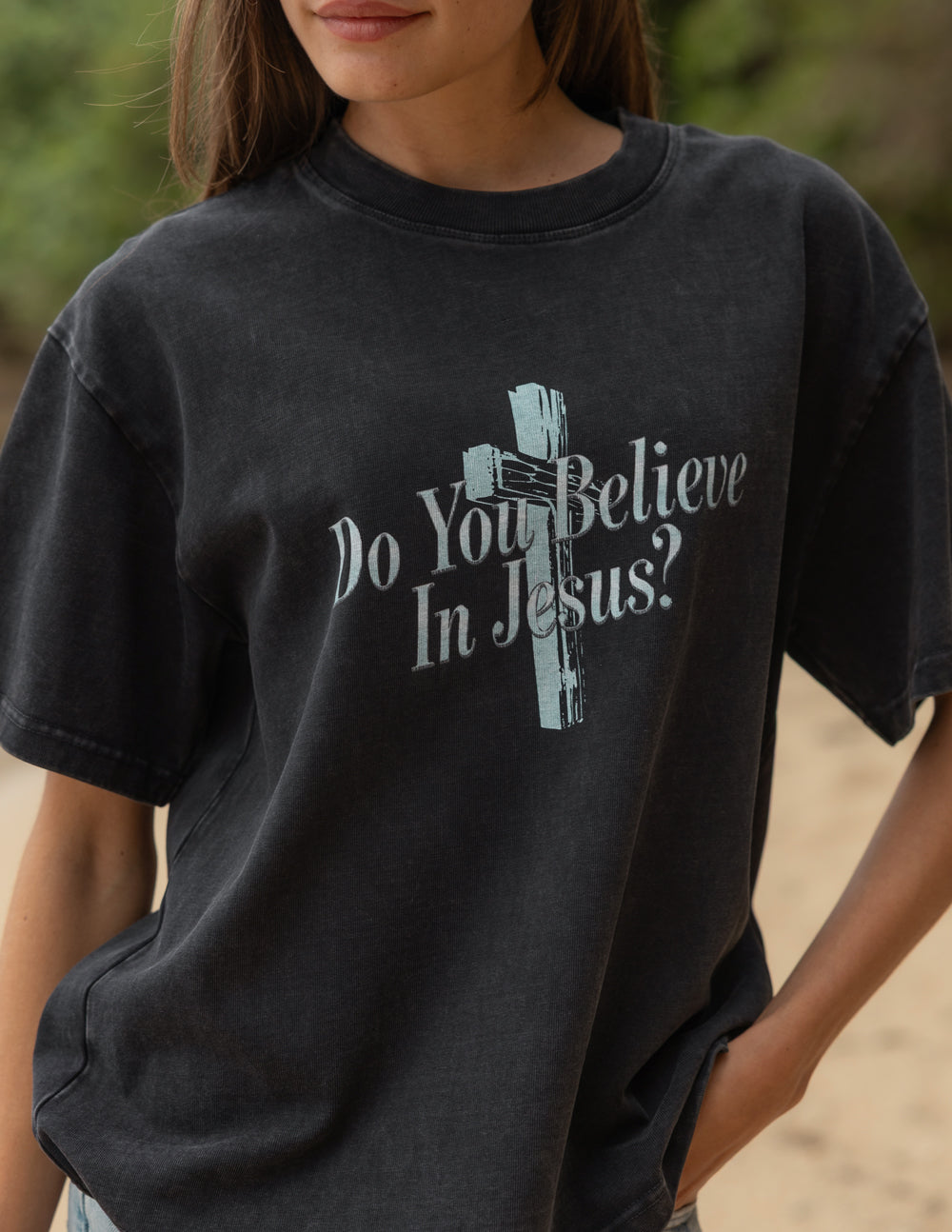 Close-up of the premium 320 GSM heavyweight cotton texture of the Do You Believe in Jesus graphic tee.