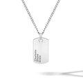 Close-up of a silver beveled tag pendant on a minimalist chain against a clean background.