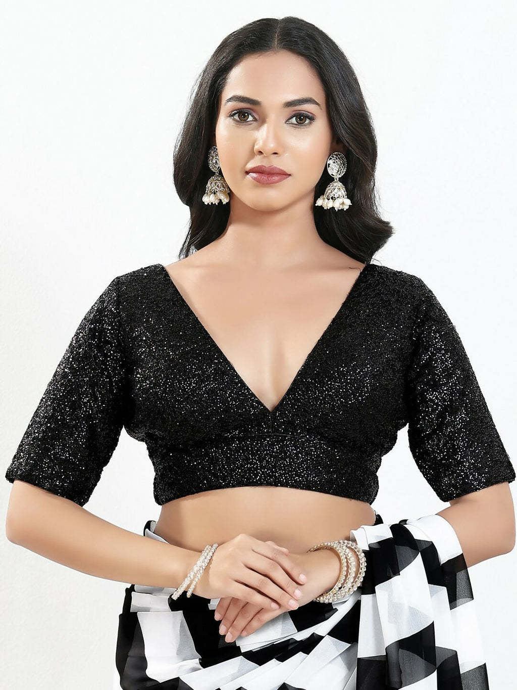 Black silk padded blouse with a V-neck and elbow length sleeves