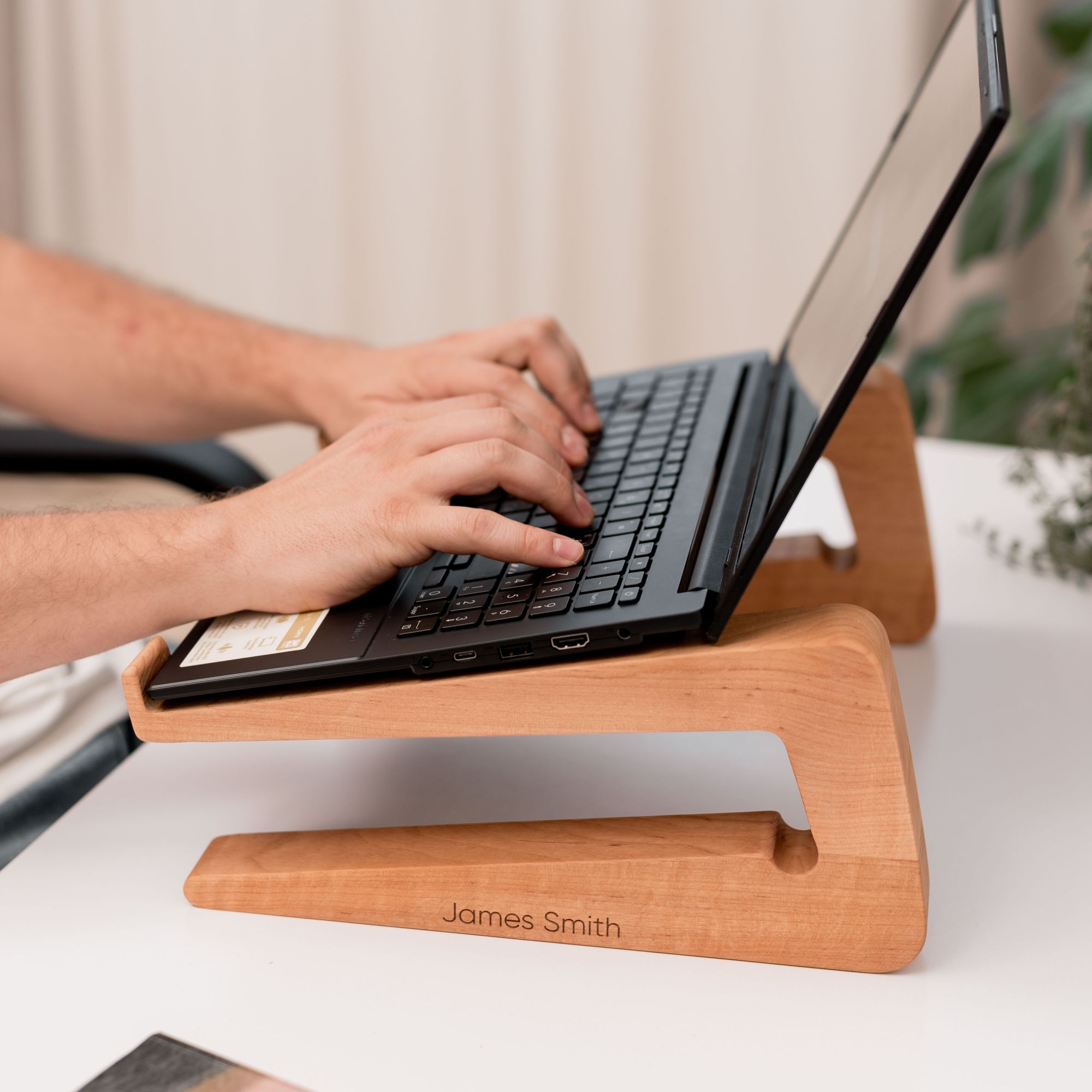 Minimalist solid wood dual laptop dock on a clean desk setup