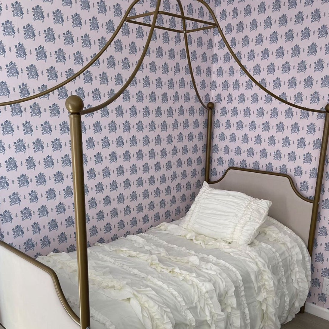 Freya floral wallpaper in soft pink and blue tones.