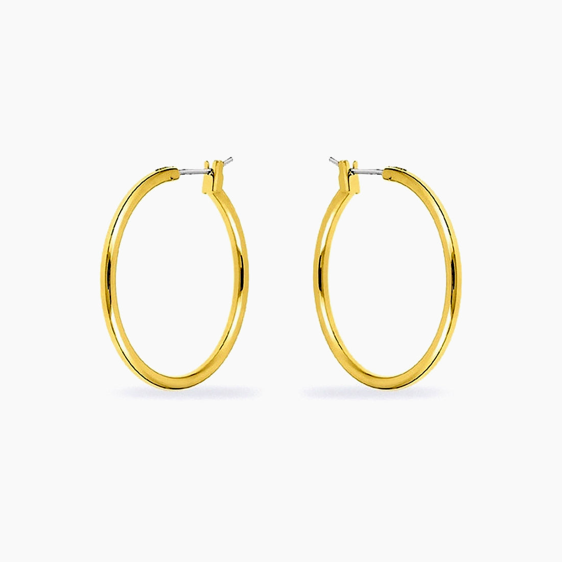 A pair of shiny 14k gold plated medium hoop earrings against a white background
