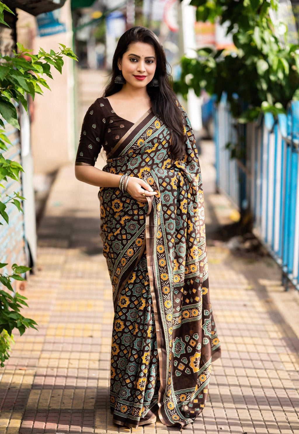 Coffee colored cotton blend Ajrak saree with zari woven border and unstitched blouse