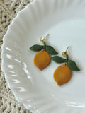 Lemon Drops handmade polymer clay earrings in bright yellow and green.