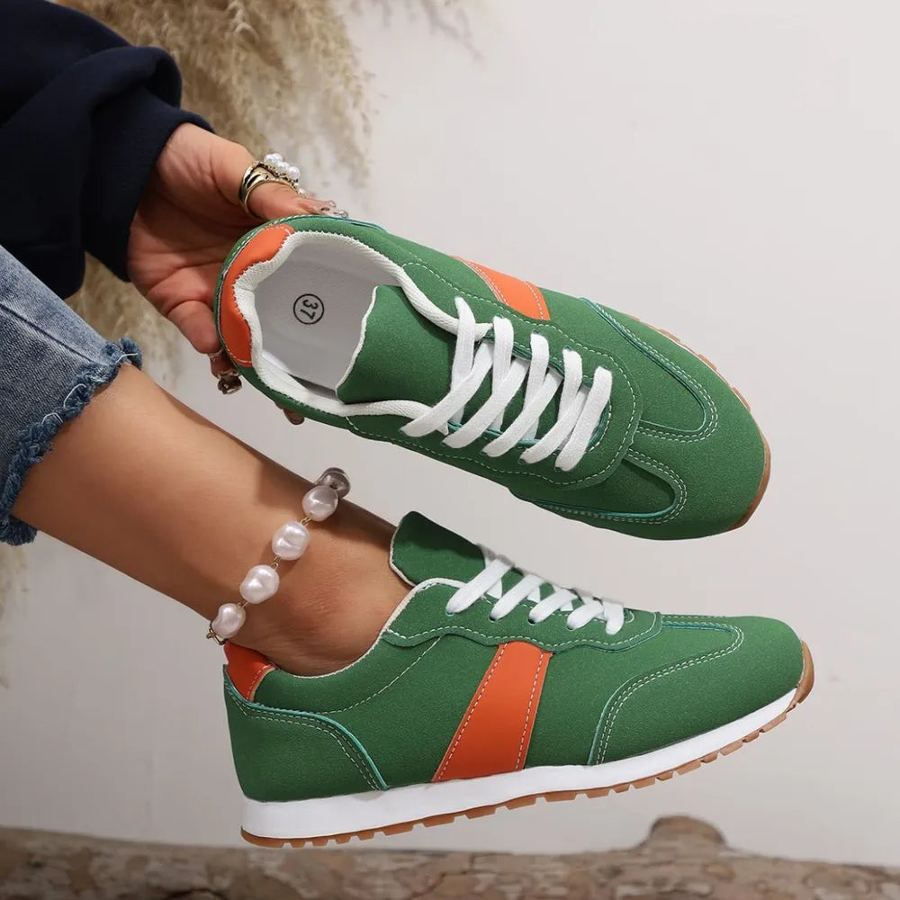 Minimalist PU leather sneakers with contrast color detailing and lace-up front