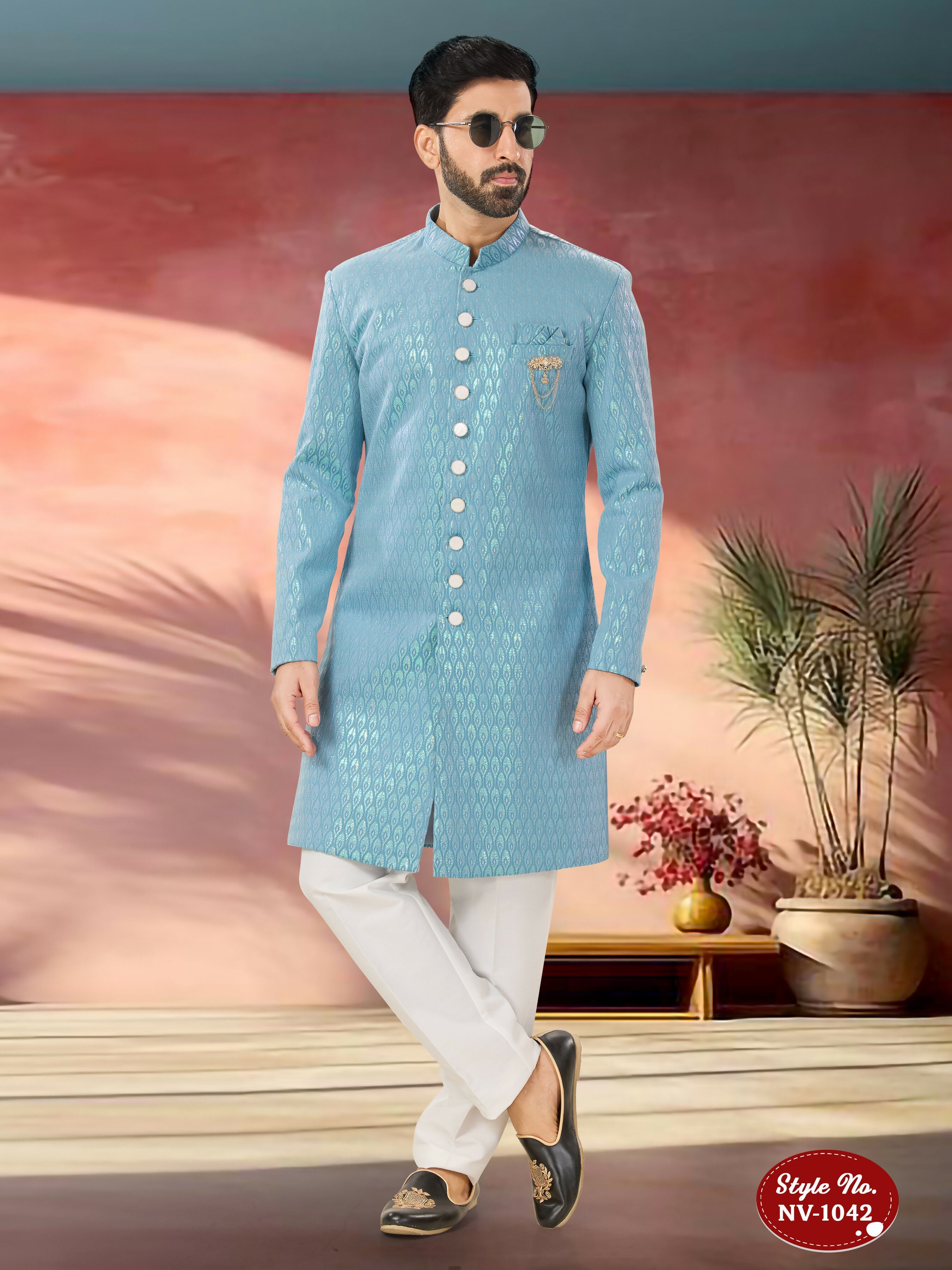 Men's blue Indo-Western kurta set with detailed thread and sequence embroidery in imported Armani fabric.