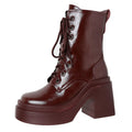 Shiny black and glossy burgundy chunky platform lace-up boots for women with thick soles and block heels, presented on a white background.