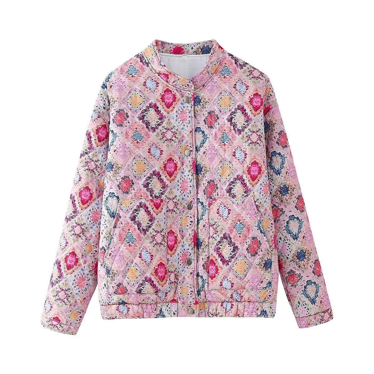 Women's pink quilted cotton jacket with a vibrant floral and geometric pattern and snap front closure.