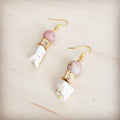 A pair of gold-tone drop earrings featuring frosted sunstone beads and rough white turquoise stones.