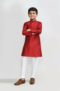A rich red Jacquard silk kurta set with white straight-fit trousers