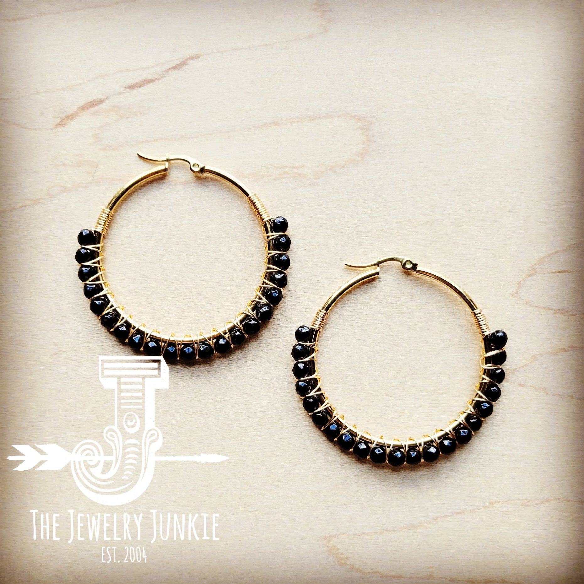 Woven black agate beaded hoop earrings with gold-tone wire