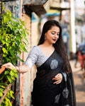 Black pure linen saree with gold zari jacquard and heavy embroidered blouse