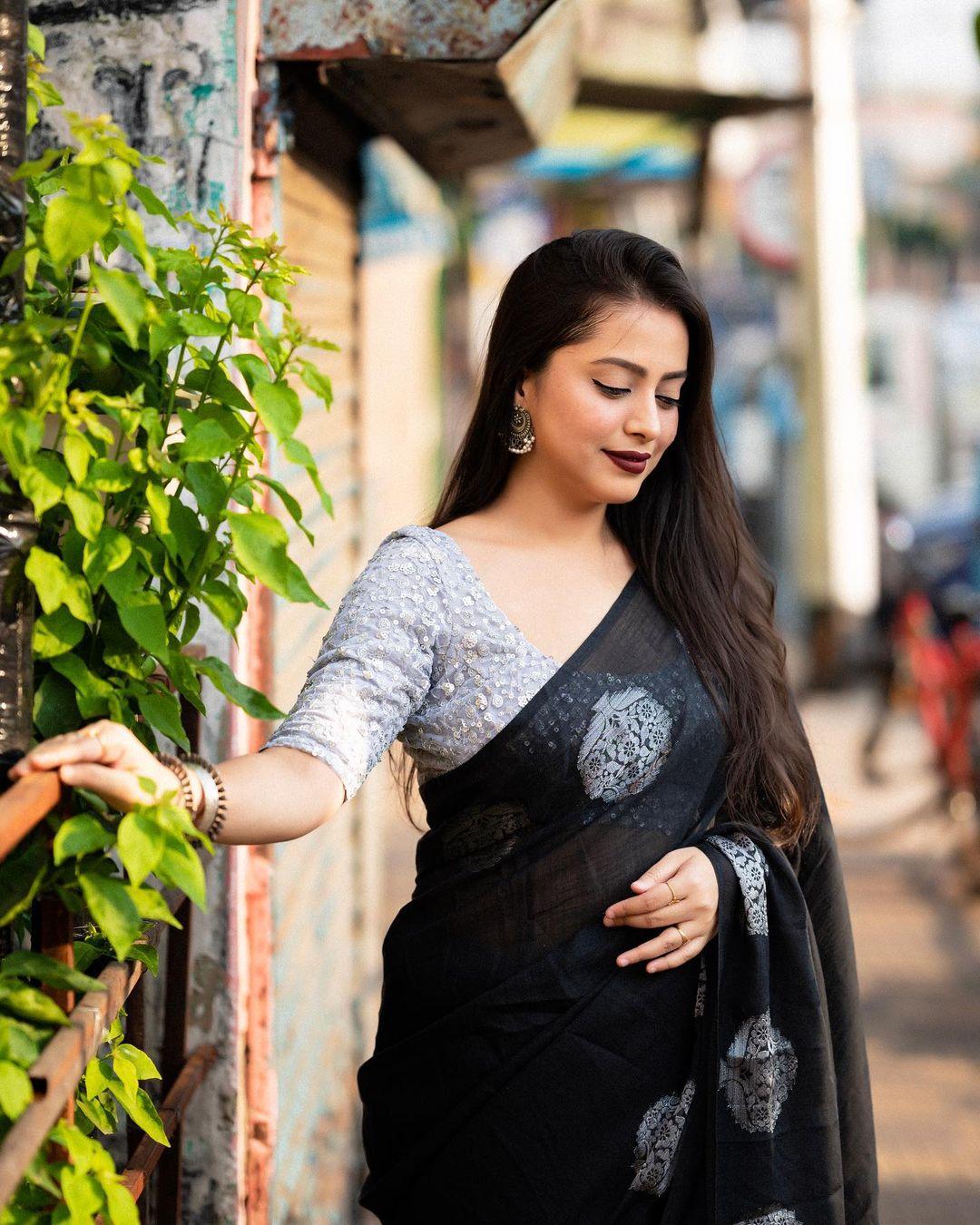 Black pure linen saree with gold zari jacquard and heavy embroidered blouse
