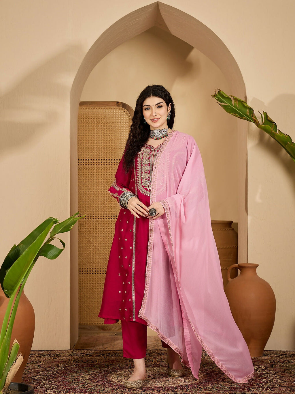 Close up of an embroidered red Vichitra silk kurta set highlighting the detailed craftsmanship