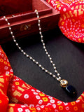 Handmade shell pearl chain necklace featuring a dark-blue Jade Kundan pendant on a gold-tone brass frame.