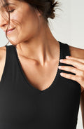 Adorn Tank in black and red with a sculpting fit and scalloped neckline.